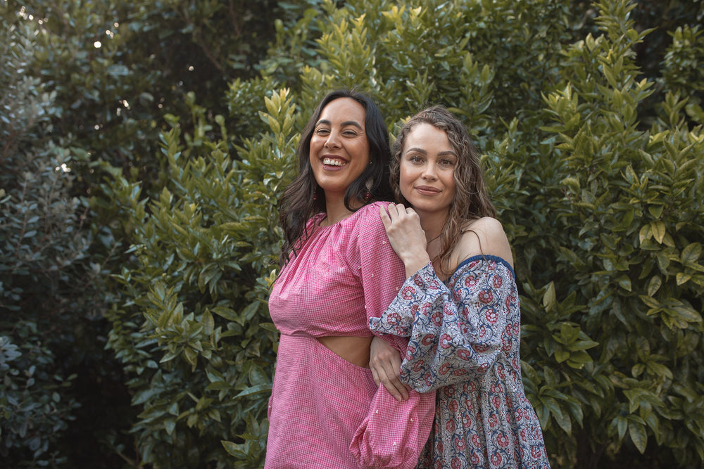 Two girls posing in pink and indigo printed cotton maxi dress
