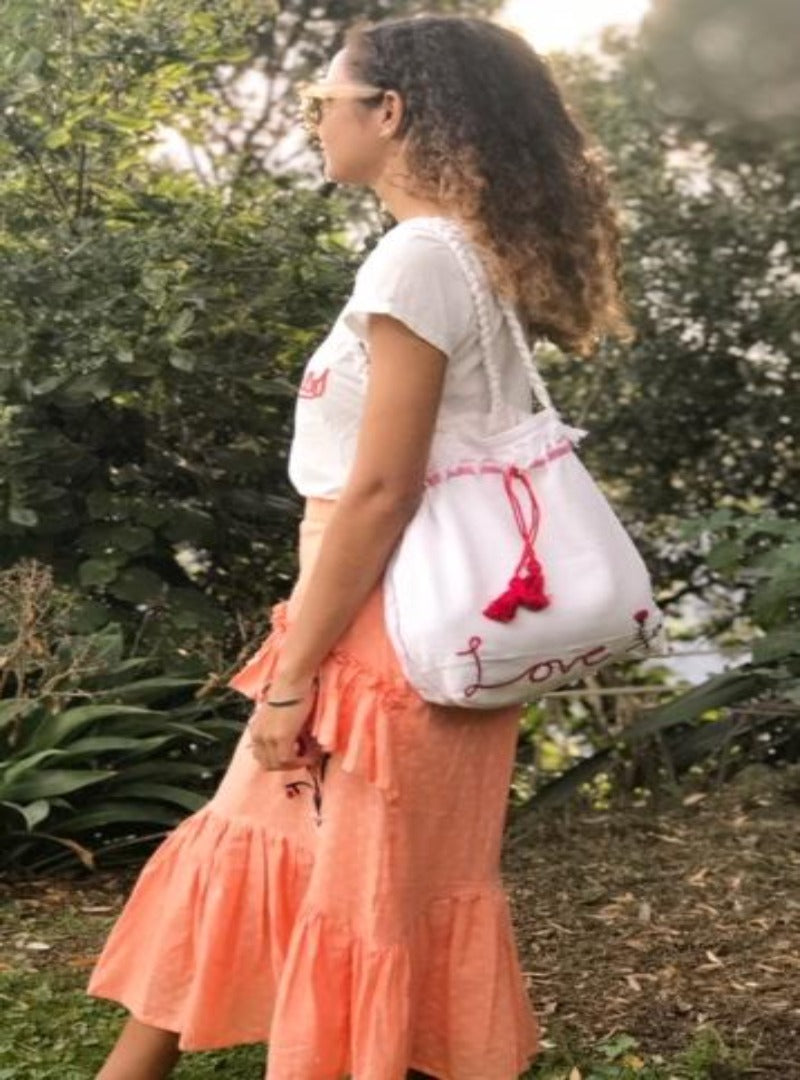 girl carrying cotton love bag